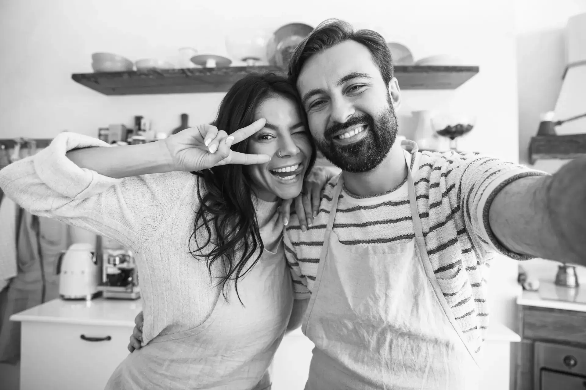 portrait-positive-couple-man-woman-wearing-aprons-taking-selfie-photo-while-cooking-kitchen-home